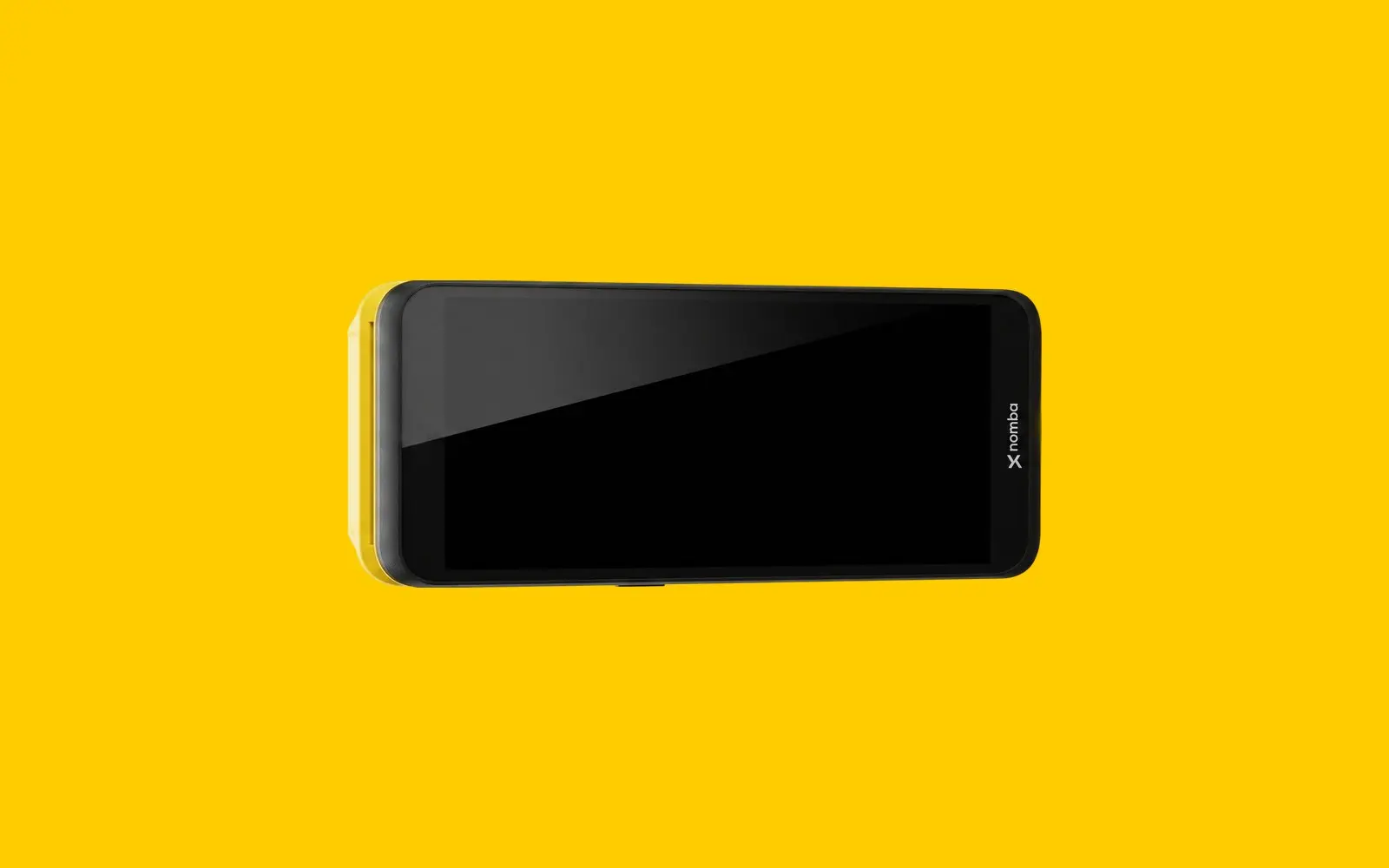 A black Nomba card payment terminal lying on its side on a yellow background