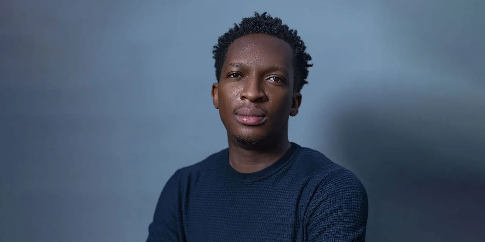 Paystack co-founder Shola Akinlade in a portrait against a grey background