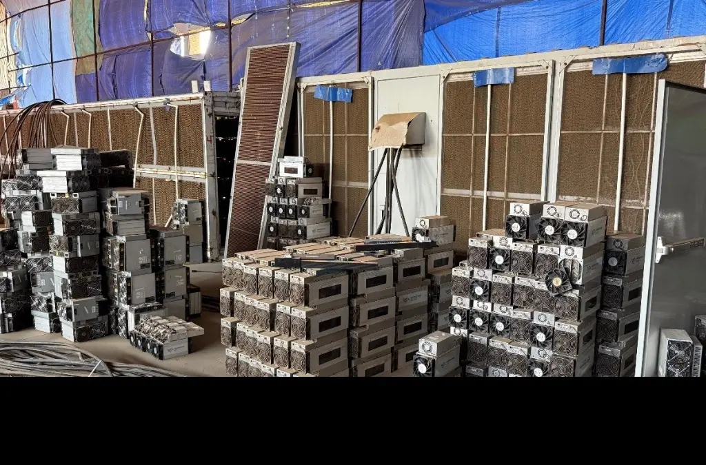 Stacks of seized cryptocurrency mining machines inside an illegal mining centre in Angola